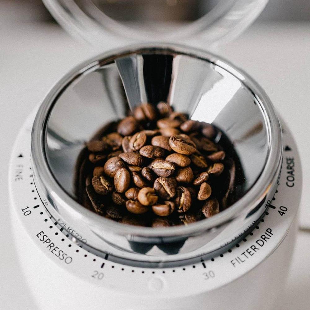 White Niche Zero with hopper full of coffee beans