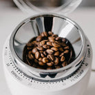 White Niche Zero with hopper full of coffee beans