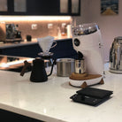 White Niche Duo on kitchen counter next to goose neck kettle and v60